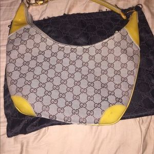100% authentic Gucci bag with yellow accents,